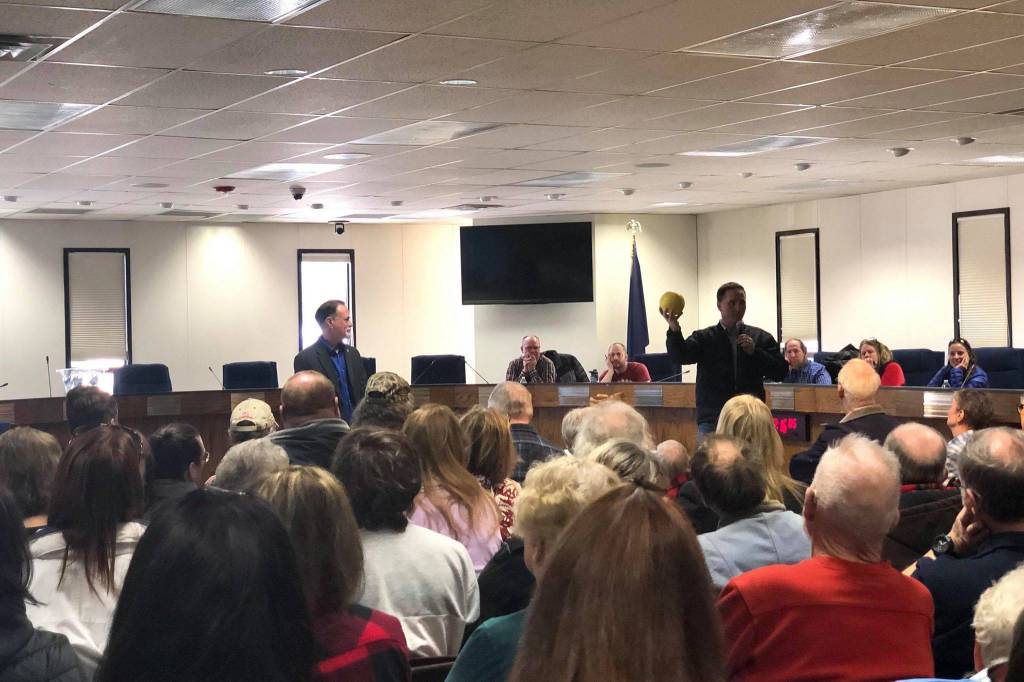 Residents pack into the Kenai Peninsula Borough Betty J. Glick Assembly Chambers for a chance to hear and speak with R-Sen. Peter Micciche (Kenai/Soldotna) and R-Rep. Ben Carpenter (Nikiski) at a town hall meeting, Saturday, Feb. 23, 2019, in Soldotna, Alaska. (Photo by Victoria Petersen/Peninsula Clarion)