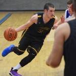 Ninilchiks Garrett Koch drives against a Cook Inlet Academy defender Wednesday at the 2019 Peninsula Conference championship tournament at Cook Inlet Academy in Soldotna. (Photo by Joey Klecka/Peninsula Clarion)