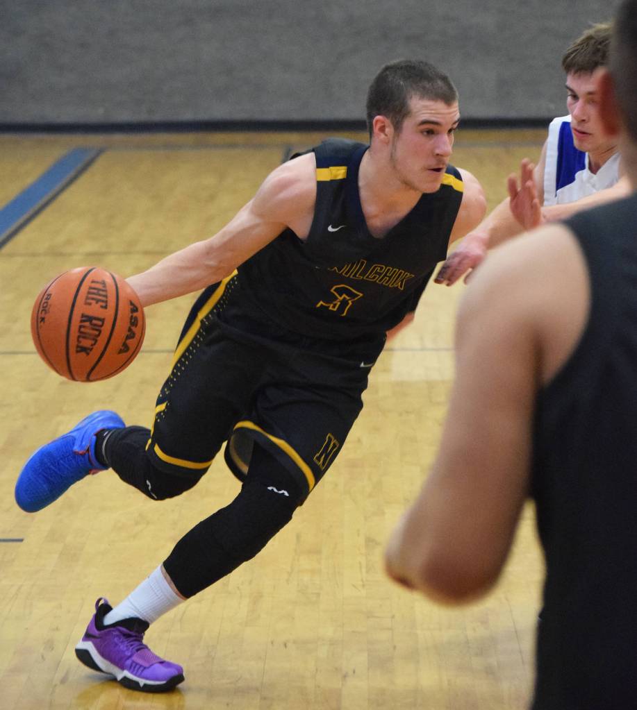 Ninilchiks Garrett Koch drives against a Cook Inlet Academy defender Wednesday at the 2019 Peninsula Conference championship tournament at Cook Inlet Academy in Soldotna. (Photo by Joey Klecka/Peninsula Clarion)