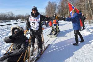 Defending champion Joar Leifseth Ulsom is greeted by local fan Ole Andersson during the ceremonial start of the Iditarod Trail Sled Dog Race Saturday in Anchorage. (AP Photo/Michael Dinneen)                                Defending champion Joar Leifseth Ulsom is greeted by local fan Ole Andersson during the ceremonial start of the Iditarod Trail Sled Dog Race Saturday, March 2, 2019 in Anchorage, Alaska. (AP Photo/Michael Dinneen)