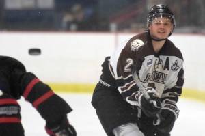 Kenai River Brown Bears defenseman Markuss Komuls makes a play on the puck Feb. 8, 2019, against the Corpus Christi (Texas) IceRays at the Soldotna Regional Sports Complex. (Photo by Jeff Helminiak/Peninsula Clarion)