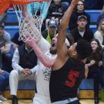 Wasillas Daniel Headdings (5) puts a block on Soldotnas David Michael Friday night in the Northern Lights Conference semifinals at Soldotna High School. (Photo by Joey Klecka/Peninsula Clarion)
