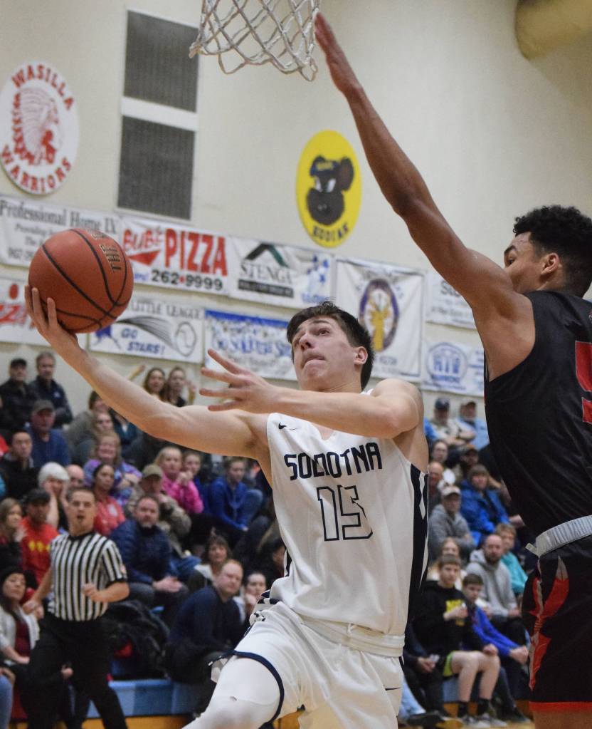 Soldotnas Jersey Truesdell puts up a shot against Wasillas Daniel Headdings Friday night in the Northern Lights Conference semifinals at Soldotna High School. (Photo by Joey Klecka/Peninsula Clarion)