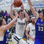 Soldotnas Ray Chumley (14) splits a pair of Palmer defenders Saturday in the Northern Lights Conference championship at Soldotna High School. (Photo by Joey Klecka/Peninsula Clarion)