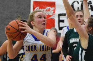 Cook Inlet Academys Adara Warren (44) steps back for a shot against a Birchwood Christian defender Feb. 27, 2019, at the Peninsula Conference championship tournament at Cook Inlet Academy in Soldotna. (Photo by Joey Klecka/Peninsula Clarion)