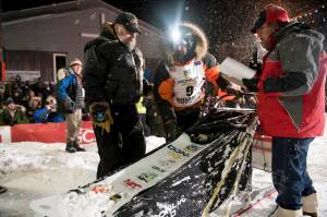 Peter Kaiser (9) checks in at the finish line, Wednesday, March 13, 2019, in Nome, Alaska, after winning the Iditarod Trail Sled Dog Race. Its the first Iditarod victory for Kaiser in his 10th attempt. (Marc Lester/Anchorage Daily News via AP)