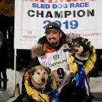Peter Kaiser (9) poses with his lead dogs, Morrow, left, and Lucy., Wednesday, March 13, 2019, in Nome, Alaska, after winning the Iditarod Trail Sled Dog Race. Its the first Iditarod victory for Kaiser in his 10th attempt. (Marc Lester/Anchorage Daily News via AP)