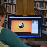 Kenai librarian Bethany McMilin demonstrates how to use Lynda.com, an online learning resource available for free through the public library system, at the Kenai Community Library on Wednesday. (Photo by Brian Mazurek/Peninsula Clarion)
