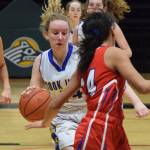 Cook Inlet Academys Adara Warren (left) races down the court Wednesday in a first-round contest against Kake at the Class 1A girls basketball state tournament at the Alaska Airlines Center in Anchorage. (Photo by Joey Klecka/Peninsula Clarion)