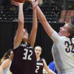 Nikolaevsks Elizabeth Fefelov (left) is rejected by Tri-Valleys Rachel Cockman Thursday at the Class 1A girls state basketball tournament in Anchorage. (Photo by Joey Klecka/Peninsula Clarion)