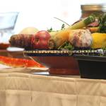 Vegetables and crab rest on a table during a cooking demo Saturday, March 9, 2019 at the Alaska Food Festival at Lands End Resort in Homer, Alaska. (Photo by Megan Pacer/Homer News)