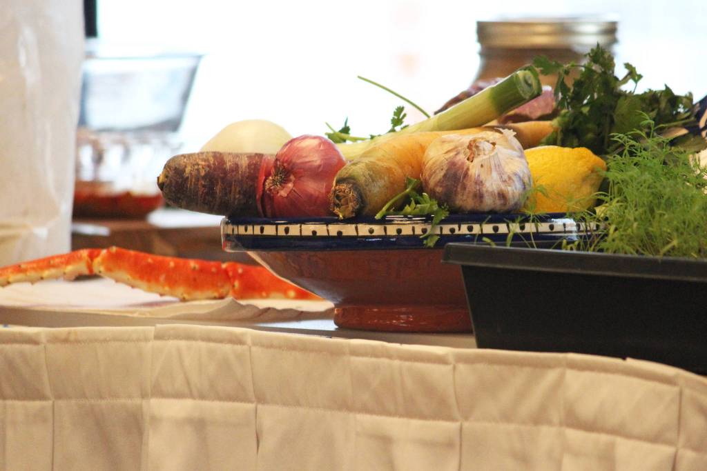 Vegetables and crab rest on a table during a cooking demo Saturday, March 9, 2019 at the Alaska Food Festival at Lands End Resort in Homer, Alaska. (Photo by Megan Pacer/Homer News)