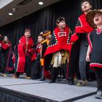 Natalie Soto, 2, helps sing with the All Nations Children Dancers as Juneau residents celebrate Indigenous Peoples Day at Elizabeth Peratrovich Hall on Monday, Oct. 9, 2017. (Michael Penn | Juneau Empire File)