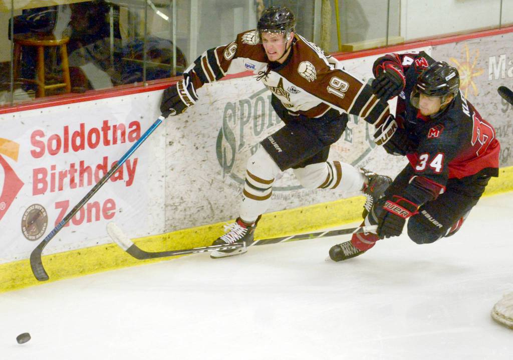 Kenai River Brown Bears forward Michael Spethmann and Minnesota Magicians defenseman Dawson Klein battle for the puck Thursday, March 14, 2019, at the Soldotna Regional Sports Complex. (Photo by Jeff Helminiak/Peninsula Clarion)