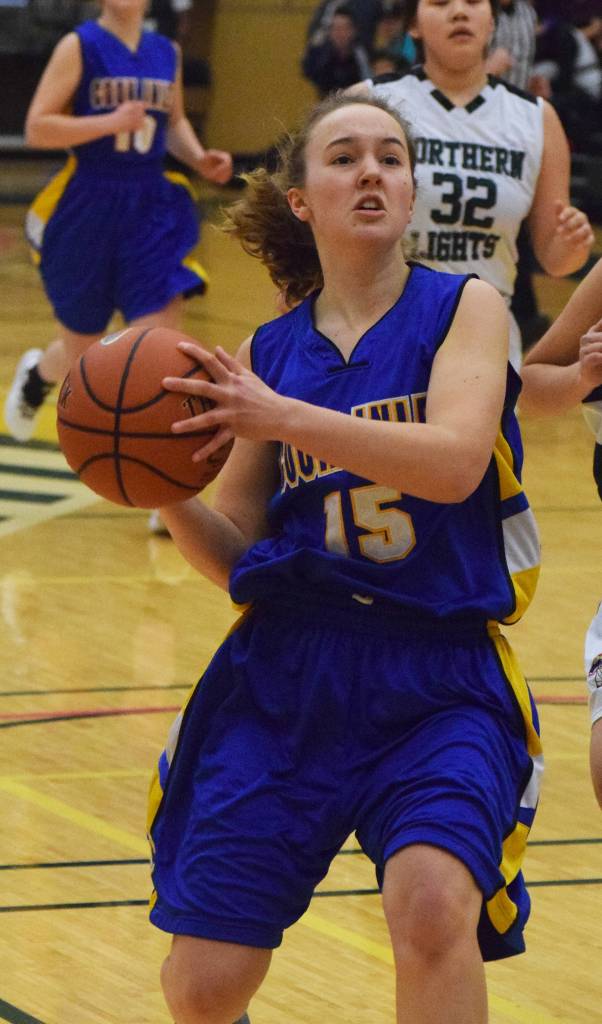 Cook Inlet Academys Adeline Nelson dribbles down the court Friday against Shishmaref at the Class 1A state tournament at the Alaska Airlines Center in Anchorage. (Photo by Joey Klecka/Peninsula Clarion)