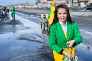 A parade participant passes out candy at Soldotnas St. Patricks Day Parade on Sunday, March 17, 2019, in Soldotna, Alaska. (Photo by Victoria Petersen/Peninsula Clarion)