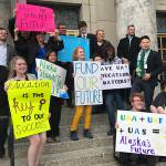 Students from the University of Alaska system pose for a photo after a rally on Monday, March 18, 2019. (Mollie Barnes | Juneau Empire)