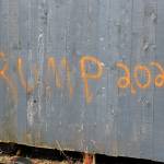 The words Trump 2020 are spray painted onto a wall at Wasabis Bistro, shown here Thursday, March 21, 2019 just outside of Homer, Alaska. (Photo by Megan Pacer/Homer News)