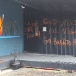 Racist messages are spray painted onto a wall at Wasabis Bistro, shown here Thursday, March 21, 2019 just outside of Homer, Alaska. (Photo by Megan Pacer/Homer News)