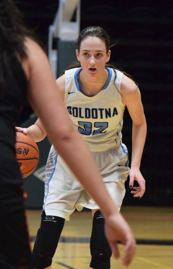 Soldotnas Danica Schmidt surveys the West Anchorage defense Thursday, Mar. 21, 2019, at the Class 4A state championship tournament at the Alaska Airlines Center in Anchorage. (Photo by Joey Klecka/Peninsula Clarion)