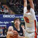 Soldotnas Jersey Truesdell (left) jukes to the right of West defender Traivar Jackson, Thursday, Mar. 21, 2019, at the Class 4A state championship tournament at the Alaska Airlines Center in Anchorage. (Photo by Joey Klecka/Peninsula Clarion)