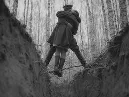 In this scene from Andrei Tarkovskys 1962 film Ivans Childhood, two characters kiss over a ravine in a birch forest.