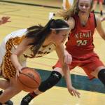 Mt. Edgecumbes Autumn Beans (left) tries to evade the defense of Kenais Brooke Satathite, Thursday, Mar. 21, 2019, at the Class 3A state championship tournament at the Alaska Airlines Center in Anchorage. (Photo by Joey Klecka/Peninsula Clarion)