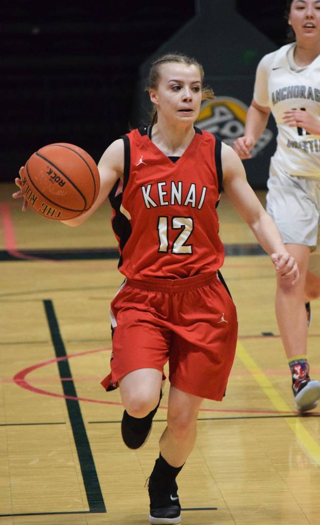 Kenais Hayley Maw dribbles the ball up the court Friday, March 22, 2019, against ACS at the Class 3A girls state tournament at the Alaska Airlines Center in Anchorage. (Photo by Joey Klecka/Peninsula Clarion)