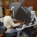 Peninsula resident Willow Kitchens tests out the Da Vinci Xi surgery robot during the Community Health Fair at Central Peninsula Hospital in Soldotna, Alaska, on March 23, 2019. (Photo by Brian Mazurek/Peninsula Clarion)