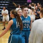 Bethany Carstens (20) walks back to the bench with her Nikiski teammates Saturday, March 23, 2019, following a loss to ACS in the Class 3A girls state basketball championship at the Alaska Airlines Center in Anchorage. (Photo by Joey Klecka/Peninsula Clarion)