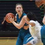 Nikiskis Kelsey Clark looks for an open teammate in front of an ACS defender Saturday, March 23, 2019, in the Class 3A girls state basketball championship at the Alaska Airlines Center in Anchorage. (Photo by Joey Klecka/Peninsula Clarion)