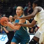 Nikiskis Kaitlyn Johnson (left) works her way around ACSs Jordan Todd on Saturday in the Class 3A girls state basketball championship at the Alaska Airlines Center in Anchorage. (Photo by Joey Klecka/Peninsula Clarion)