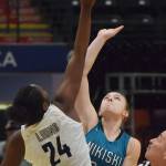 Nikiskis Bethany Carstens (right) and ACSs Jordan Todd tip off to begin Saturdays Class 3A girls state basketball championship at the Alaska Airlines Center in Anchorage. (Photo by Joey Klecka/Peninsula Clarion)