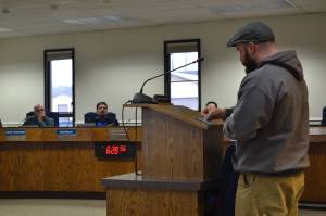 Dustin Poindexter, of Anchor Point, speaks to the Kenai Peninsula Borough School District Board of Education in support of his childrens school, Chapman School, on Thursday, March 21, 2019, in Soldotna, Alaska. (Photo by Victoria Petersen/Peninsula Clarion)