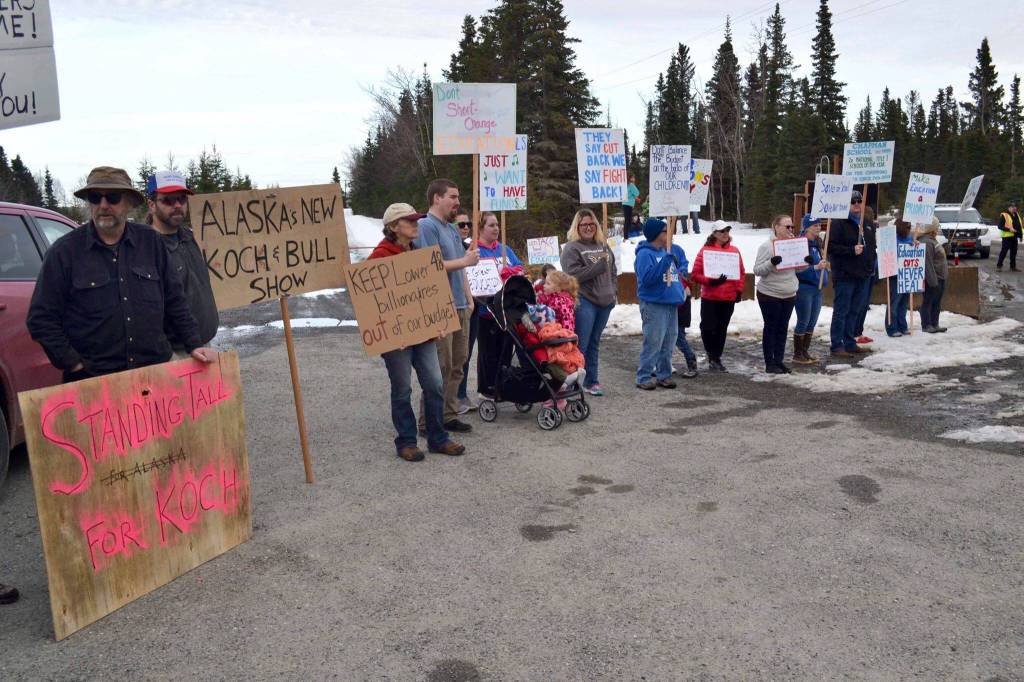 Protesters stand outside the Cannery Lodge in Kenai, Alaska, ahead of Gov. Mike Dunleavys presentation about his proposed budget on March 26, 2019. (Photo by Victoria Petersen/Peninsula Clarion)