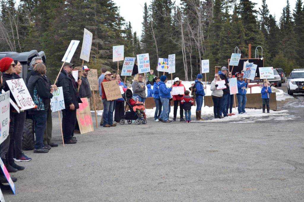 Protestors stand outside the Cannery Lodge in Kenai, AK ahead of Governor Dunleavys presentation about his proposed budget on March 26, 2019. (Photo by Victoria Petersen/Peninsula Clarion)