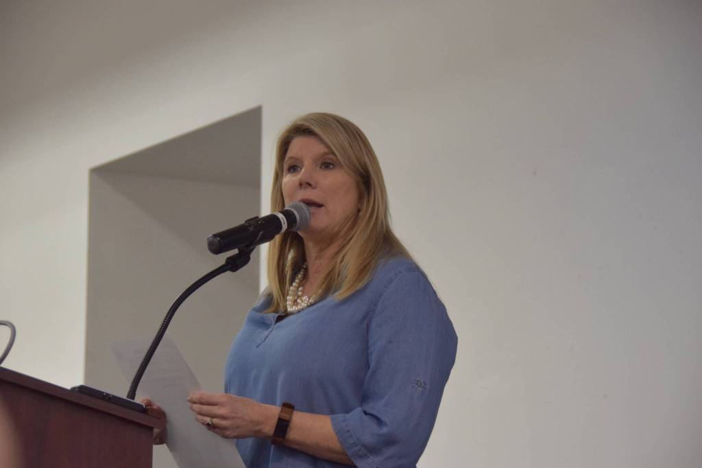 Elaine Spraker reads a letter from U.S. Senator Dan Sullivan , R-Alaska, during the annual Choose Respect March in Kenai, Alaska, on Wednesday, March 27, 2019. (Photo by Brian Mazurek/Peninsula Clarion)