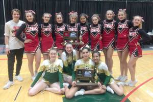 The Seward and Kenai Central cheerleading squads pose after the March Madness Alaska state cheerleading competition at the Alaska Airlines Center in Anchorage on March 20. Kenai, in the top row, is Samuel Ward, Hannah Olson, Nia Calvert, Arielle Hamar, Karley Harden, Sirinda Rongsakul, Morgan Mallory, Rileigh Pace, Keelin McGraw and Valerie Brophy. The Seward squad, bottom row, is Emilia Whitcomb, Kyrsten Johnson-Gray, Gaia Casagranda and Jessica Batubara. (Photo provided by Kenai Central)