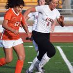 Kenais Anya Danielson (right) battles for possession with Wests Xaofeil Metcalf Thursday, April 4, 2019, in a nonconference game at Kenai Central High School. (Photo by Joey Klecka/Peninsula Clarion)