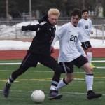 Kenais Leif Lofquist (left) battles with Wests Isaac Main Thursday, April 4, 2019, in a nonconference game at Kenai Central High School. (Photo by Joey Klecka/Peninsula Clarion)
