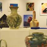 Art pieces are on display at the Kenai Fine Arts Center during Thursdays opening reception of the 30th anniversary Visual Feast art show. (Photo by Joey Klecka/Peninsula Clarion)