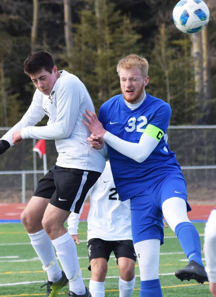 Soldotnas Brace Rosin (32) goes up for a header against a West Anchorage player Friday, April 5, 2019, in a nonconference contest at Soldotna High School. (Photo by Joey Klecka/Peninsula Clarion)