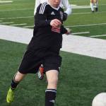 Kenai Central sophomore Francisco Garmen Munarriz dribbles the ball up field against West Anchorage in a nonconference game Thursday, April 4, 2019, at Ed Hollier Field. (Photo by Joey Klecka/Peninsula Clarion)