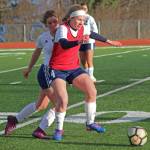 Homers Jessica Sonnen fights to keep the ball from Soldotna High School possession during a Tuesday game in Homer. The teams tied 3-3. (Photo by Megan Pacer/Homer News)
