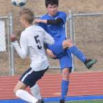 Homers Austin Cline and Soldotnas Trenton OReagan battle for the ball Tuesday at Soldotna High School in Soldotna. (Photo by Jeff Helminiak/Peninsula Clarion)