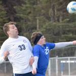 Homers Henry Russell and Soldotnas Cameron Johnson battle for the ball Tuesday at Soldotna High School in Soldotna. (Photo by Jeff Helminiak/Peninsula Clarion)