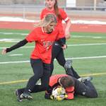 Nikiski goalkeeper Abby Bystedt (on ground) saves a shot taken by Kenais Karley Harden Thursday in a Peninsula Conference clash at Kenai Central High School. (Photo by Joey Klecka/Peninsula Clarion)