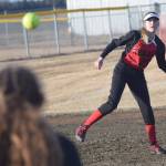 Kenai Central shortstop Zaharah Wilshusen throws to first baseman Lexi Reis for an out Friday, April 12, 2019, at Steve Shearer Memorial Ball Park in Kenai, Alaska. (Photo by Jeff Helminiak/Peninsula Clarion)