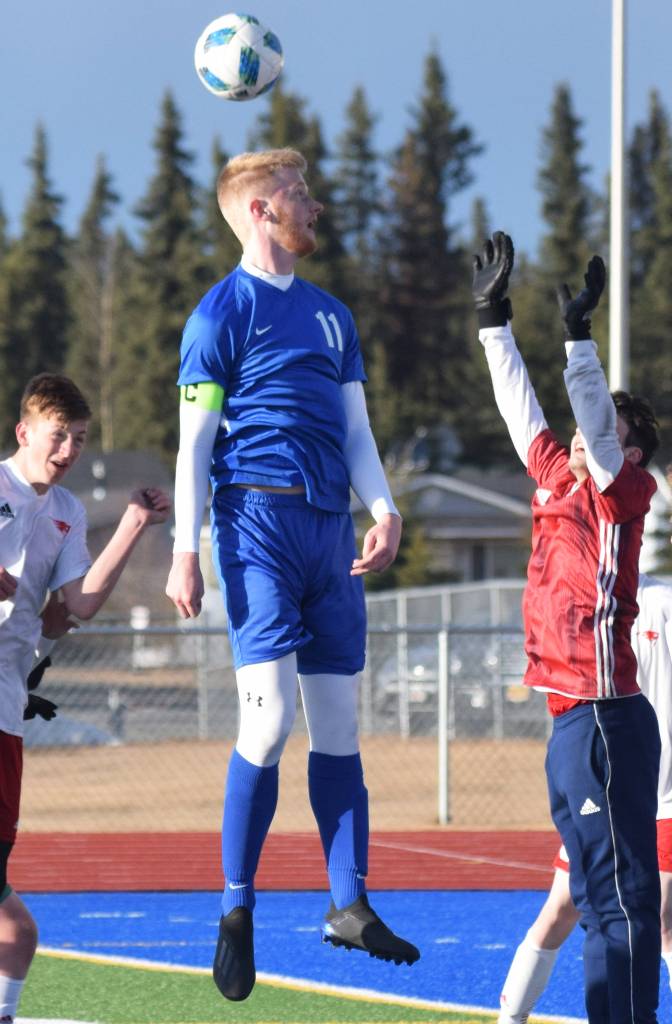Soldotnas Levi Rosin gets his head on a corner kick Friday, April 12, 2019, in a nonconference game against North Pole at Soldotna High School. (Photo by Joey Klecka/Peninsula Clarion)