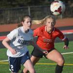 Homers Laura Inama and Kenai Centrals Damaris Severson battle for the ball Tuesday, April 16, 2019, at Kenai Central High School in Kenai, Alaska. (Photo by Jeff Helminiak/Peninsula Clarion)